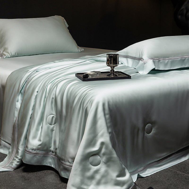 Luxurious satin bed set with silk-like surface and fine decorative stitching
