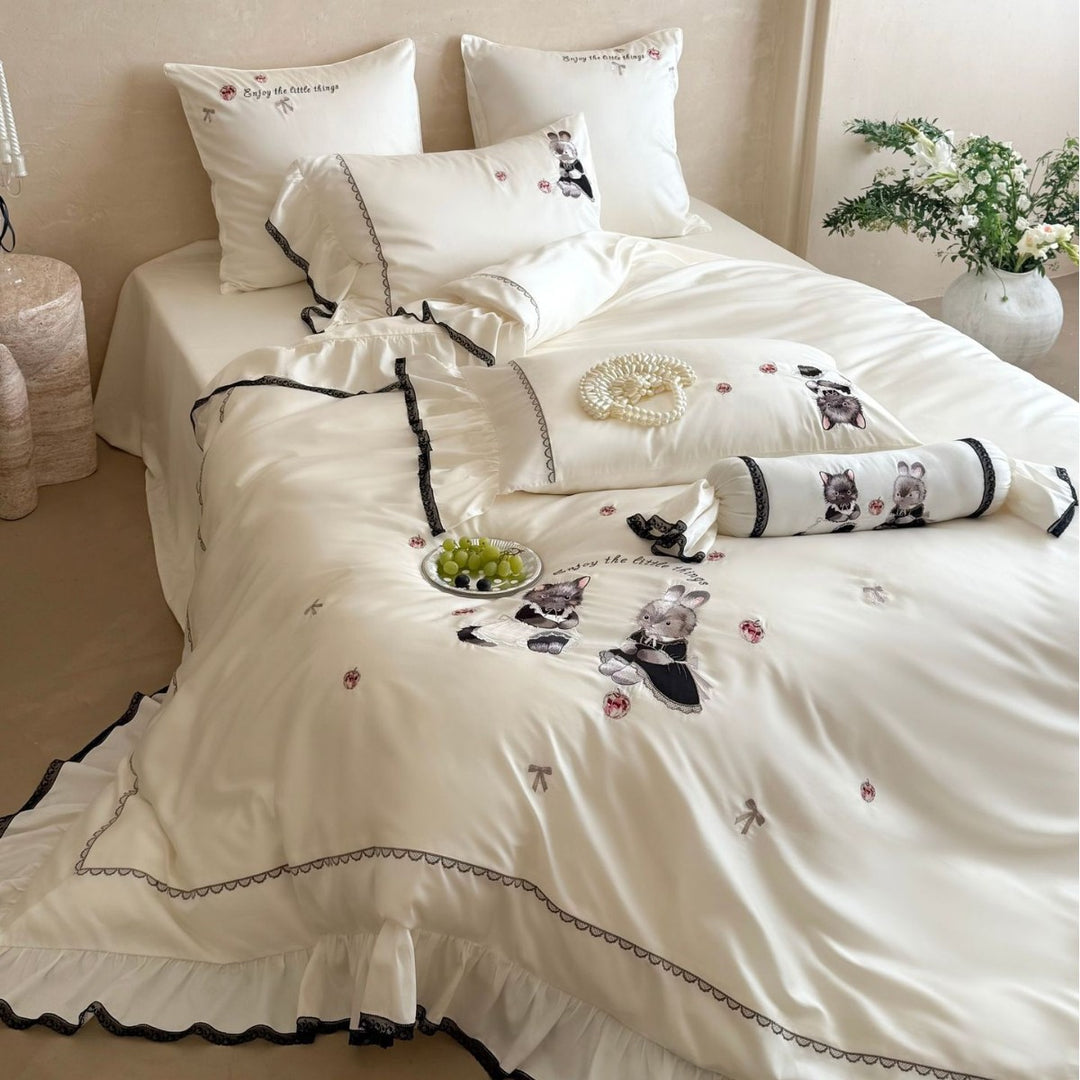 Embroidered satin bedding set with frill, ruffled hem, and animal motif