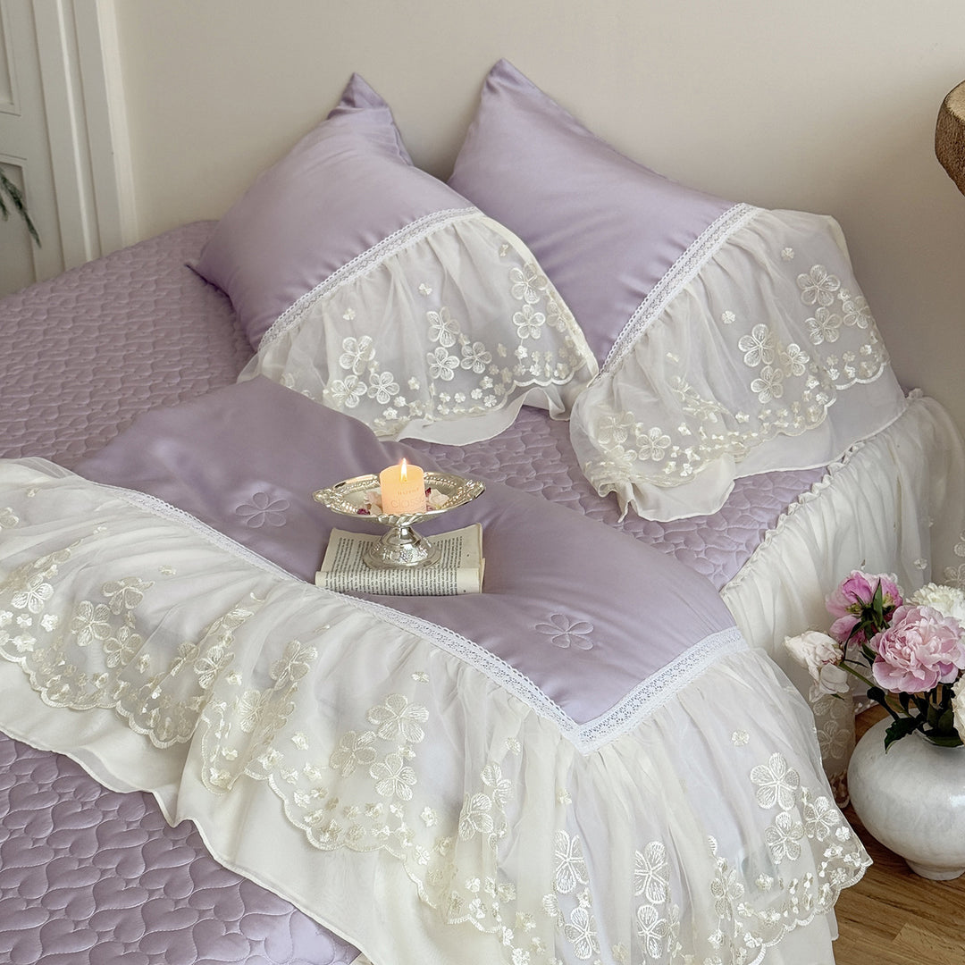 Satin bed linen set with embroidered chiffon ruffle and quilted bedspread