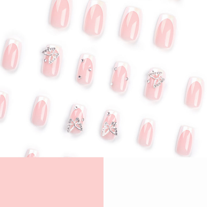 Elegant Nail Art with Glitter and Floral Accents Kalsten