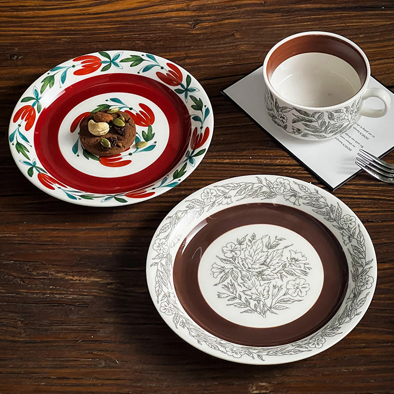 Deep porcelain plate with floral rim ornamentation and contrasting inner mirror