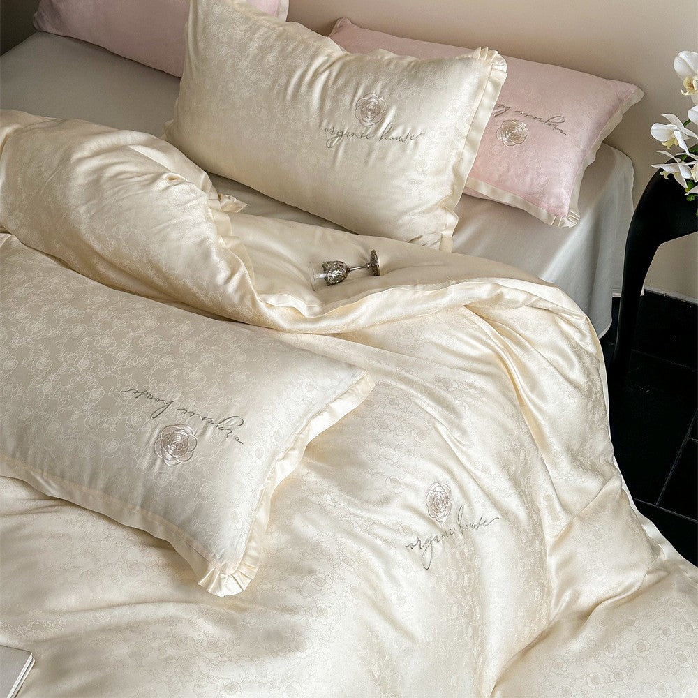 Luxurious cotton satin bedding set with jacquard relief and embroidered rose motif