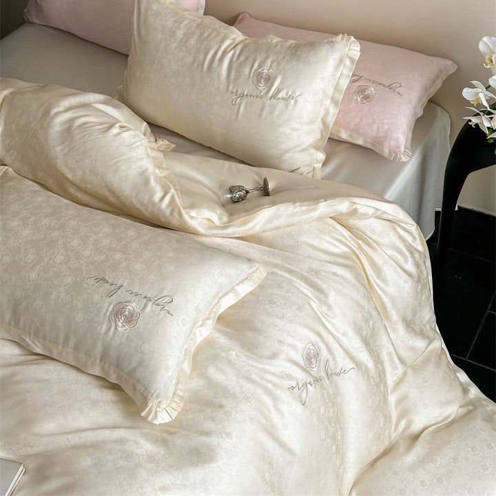 Luxurious cotton satin bedding set with jacquard relief and embroidered rose motif
