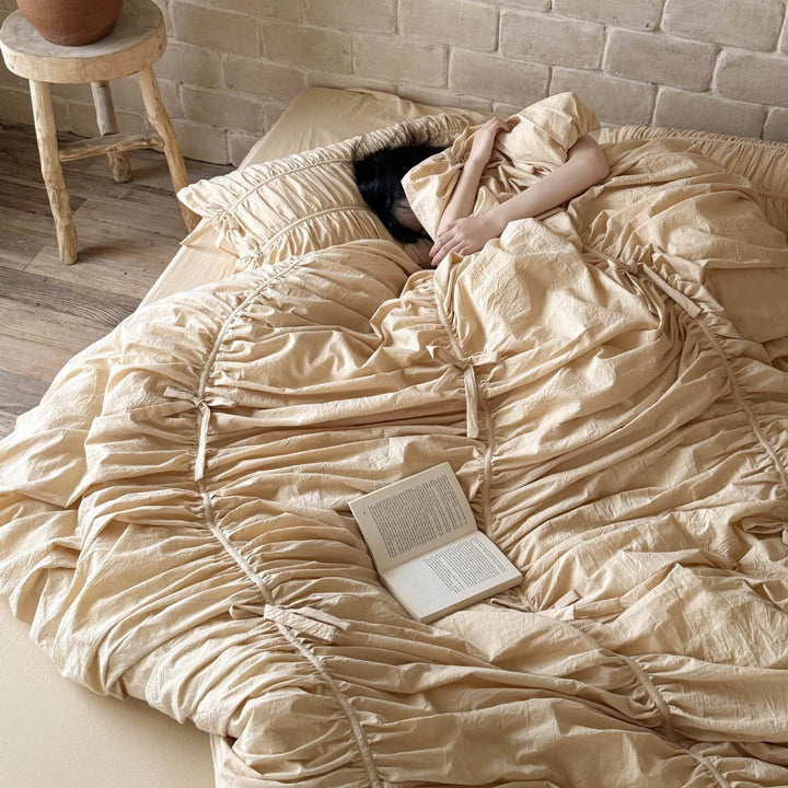 Luxurious gathered bedding set with ruffle, frills, and ties