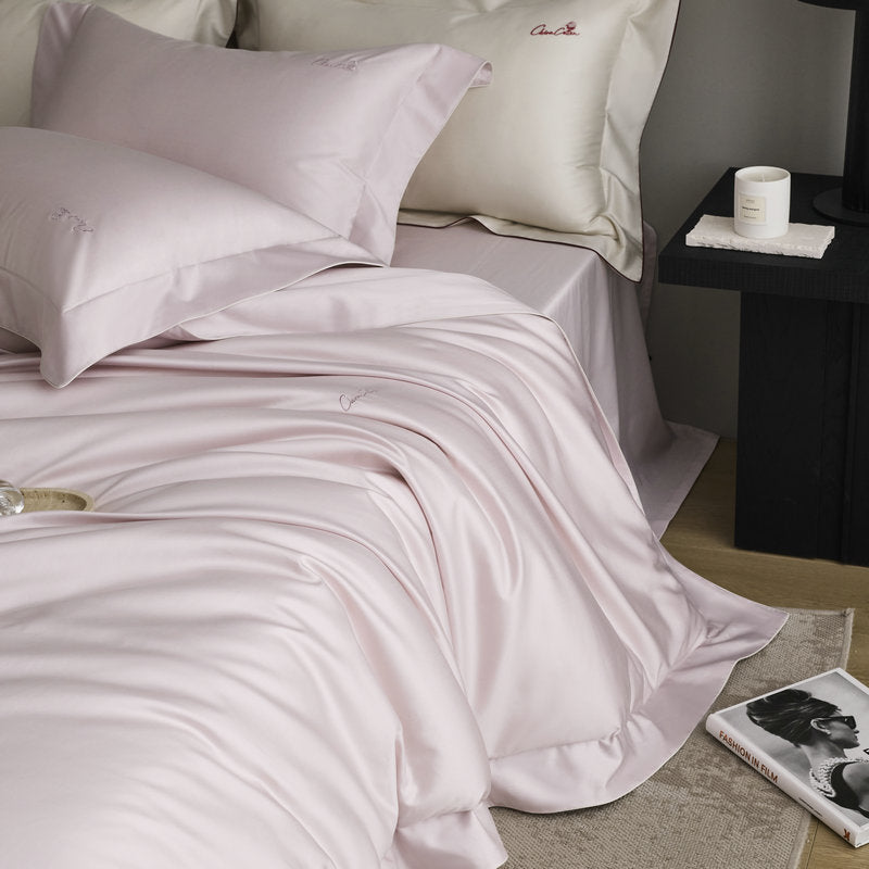 Bedding set made of fine satin with a silky-smooth finish and embroidered logo