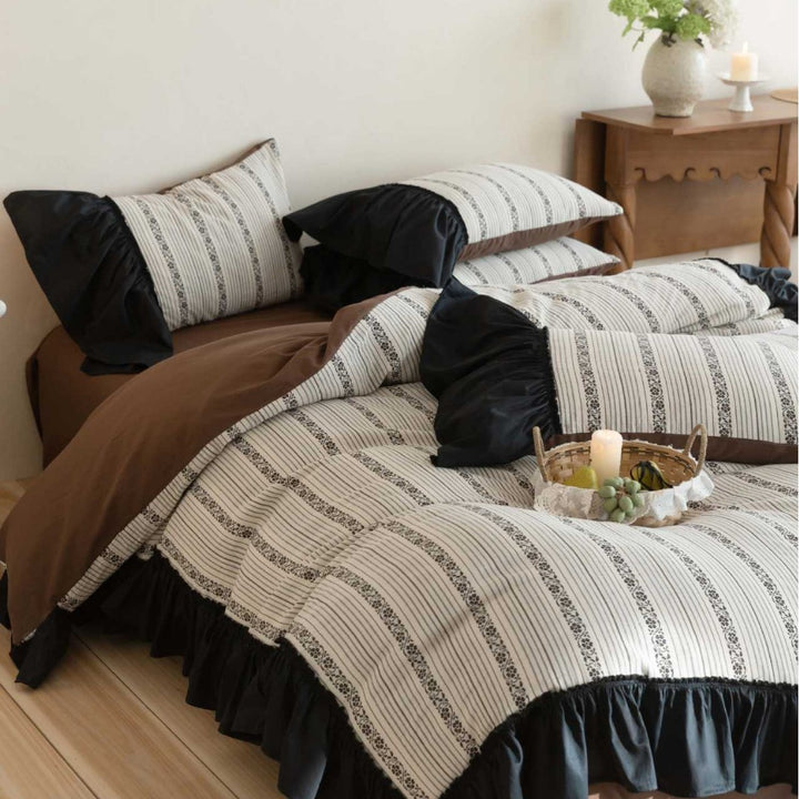 Ruffled duvet cover set with striped jacquard trim and reversible pillow
