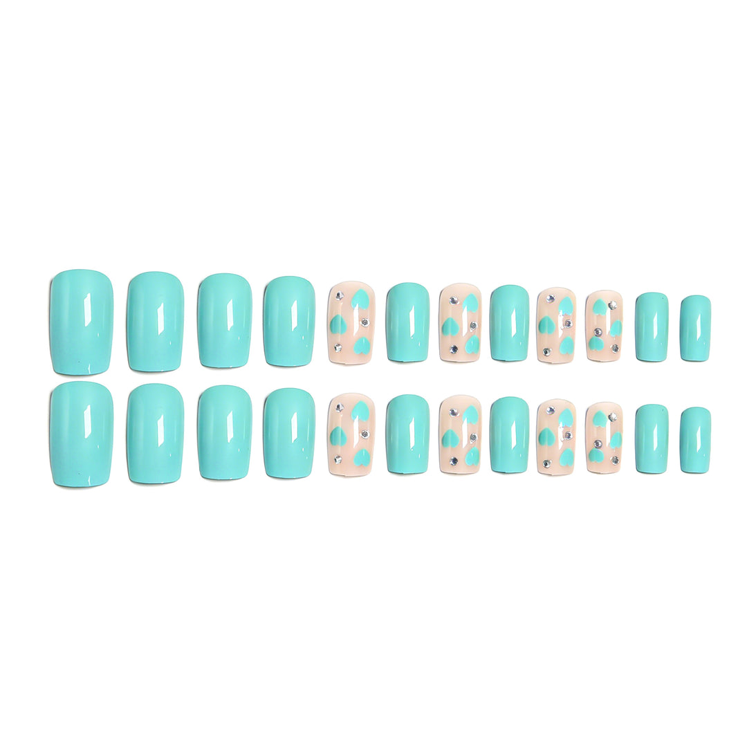 Nail art with heart designs and glitter accents Kalsten