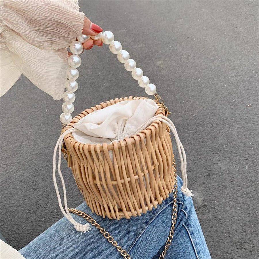 Women’s handbag with elegant pearl handle and braided design Kalsten