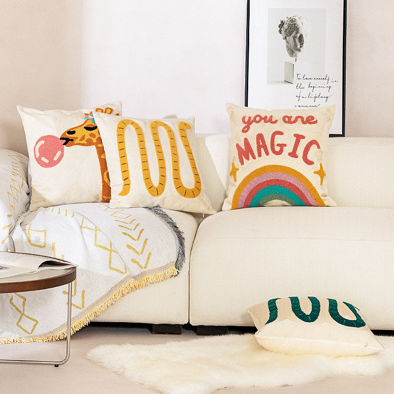 Decorative pillowcase with hand-tufted giraffe and rainbow motif