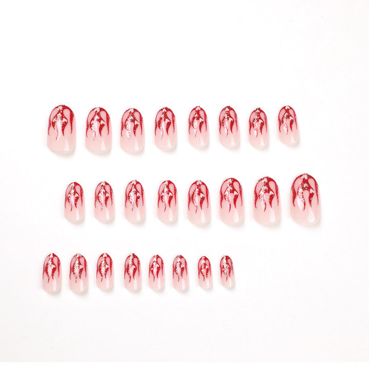 Artificial nail art with romantic heart and flame design Kalsten
