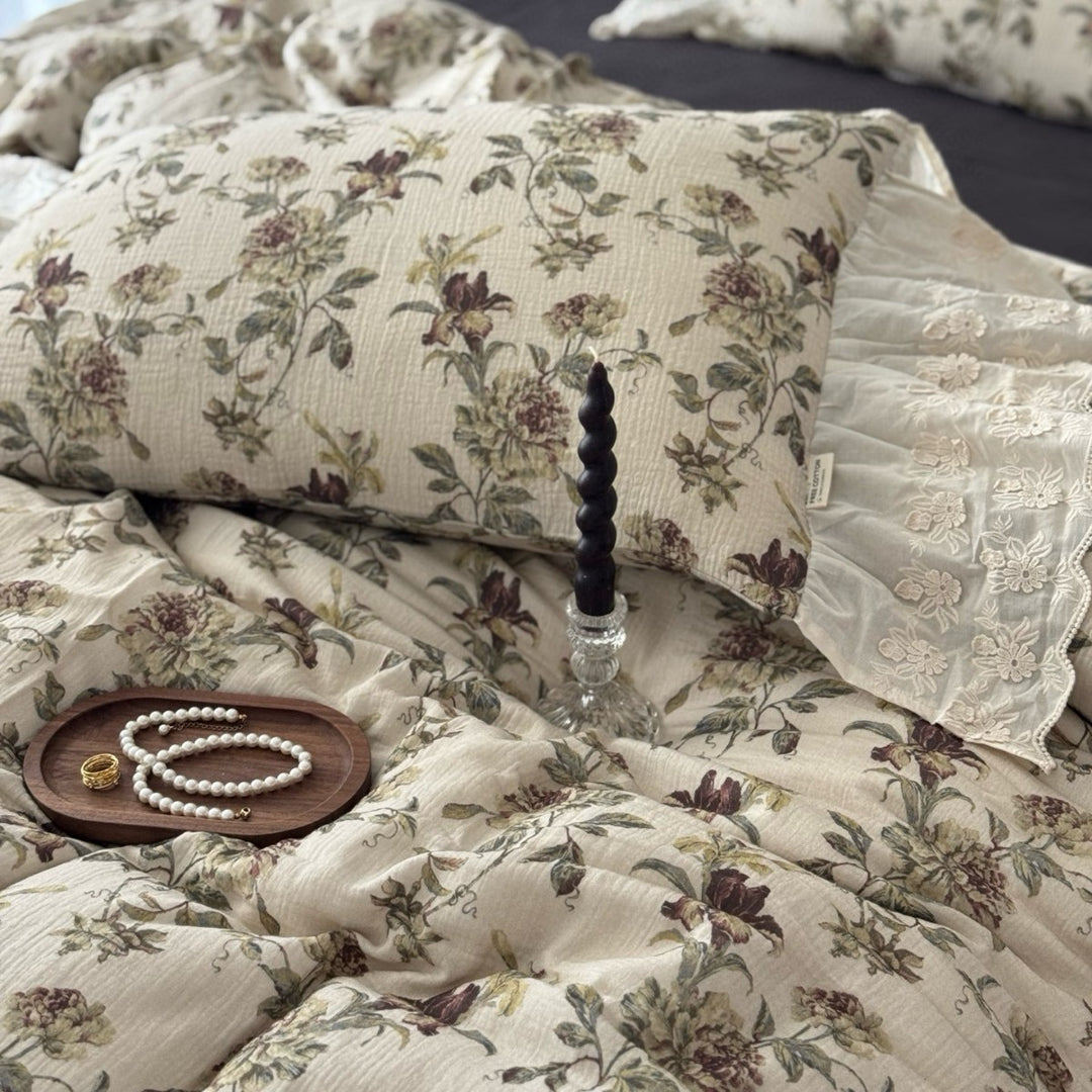 Floral quilted comfort bedspread with lace trim and decorative ruffle