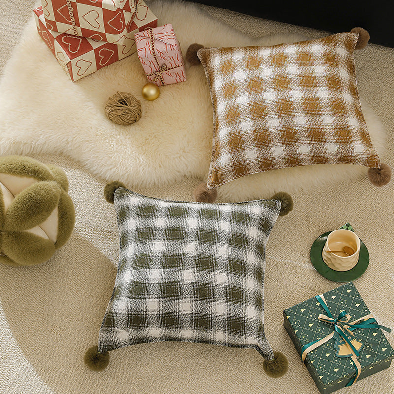 Square living decorative pillow with woven check structure and pom-pom corners