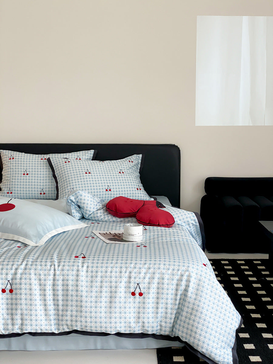 Playful cotton satin bedding set with cherry print and fine check pattern