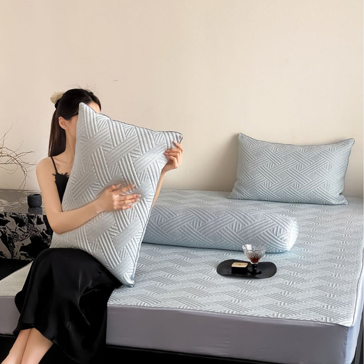 Quilted bedspread set with ginkgo leaf relief, ruffled bed skirt and pillowcases