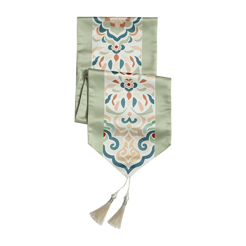 Handcrafted satin table runner with Oriental medallion pattern and decorative tassels