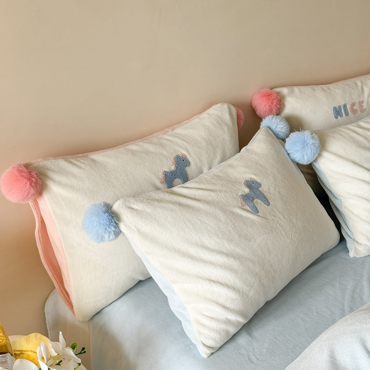 Cozy cotton bedding set with pom-pom appliques and embroidered lettering