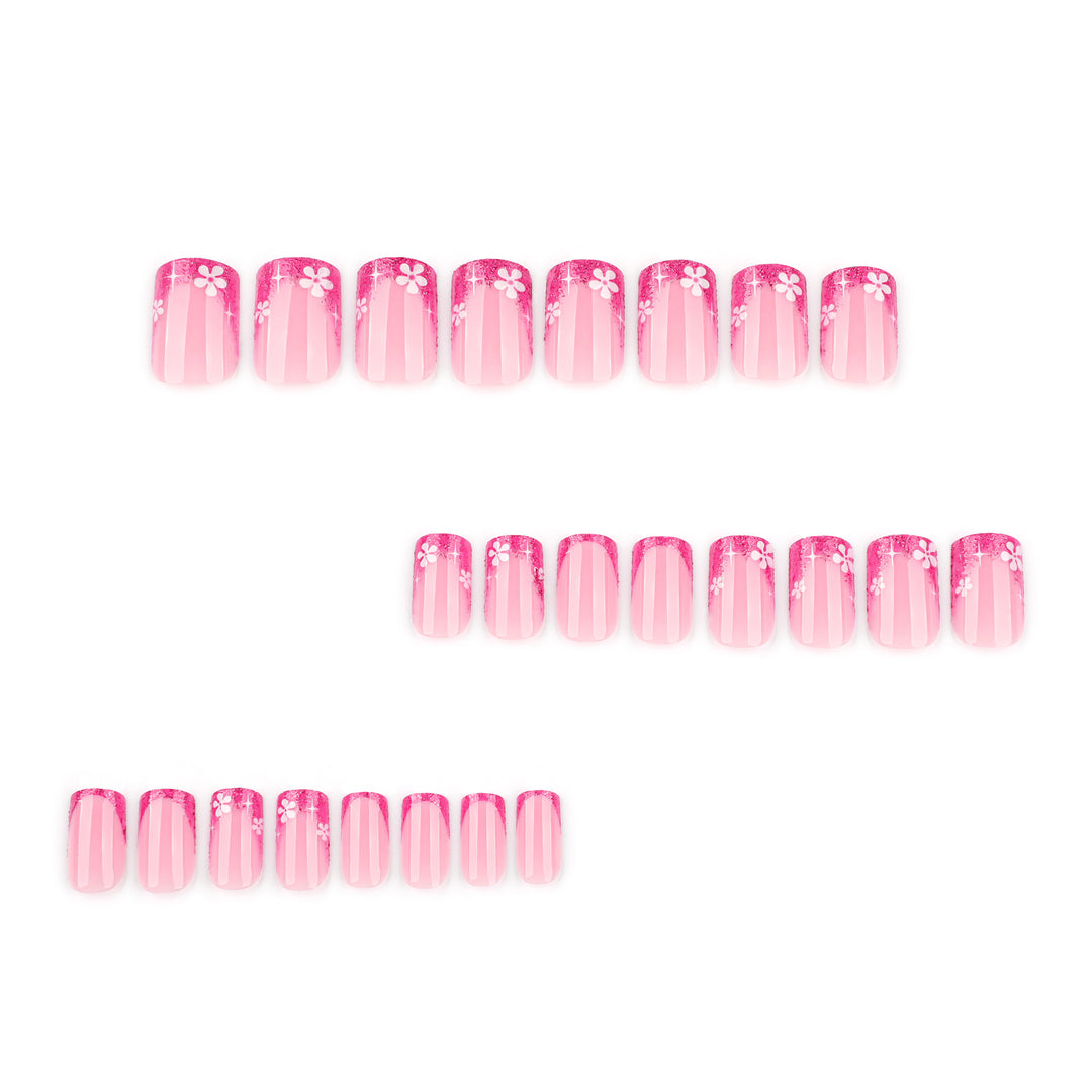 Artistic nail art with floral accent and glitter Kalsten