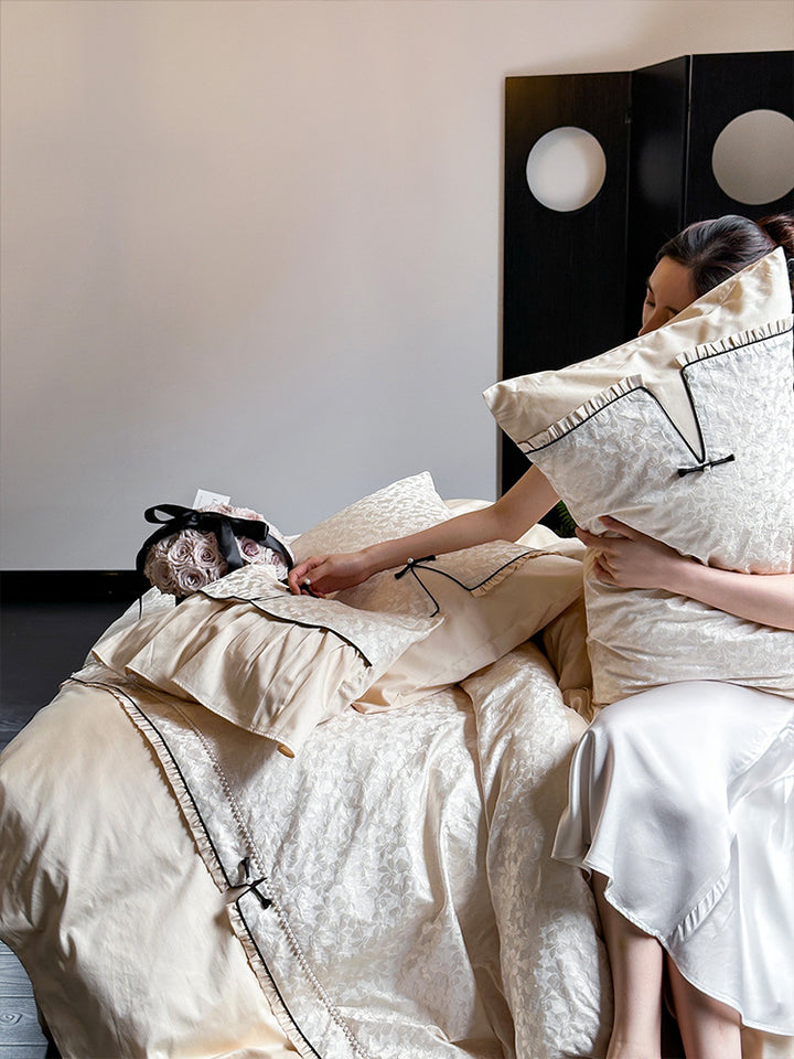 Elegant jacquard bedding set with floral relief structure, ruffles and contrasting piping