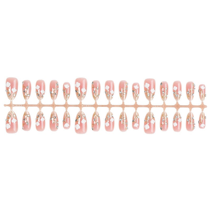 Artificial nail set with delicate floral patterns and elegant accents Kalsten
