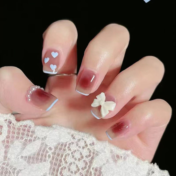 Artistic and elegant nail art with bow accents Kalsten