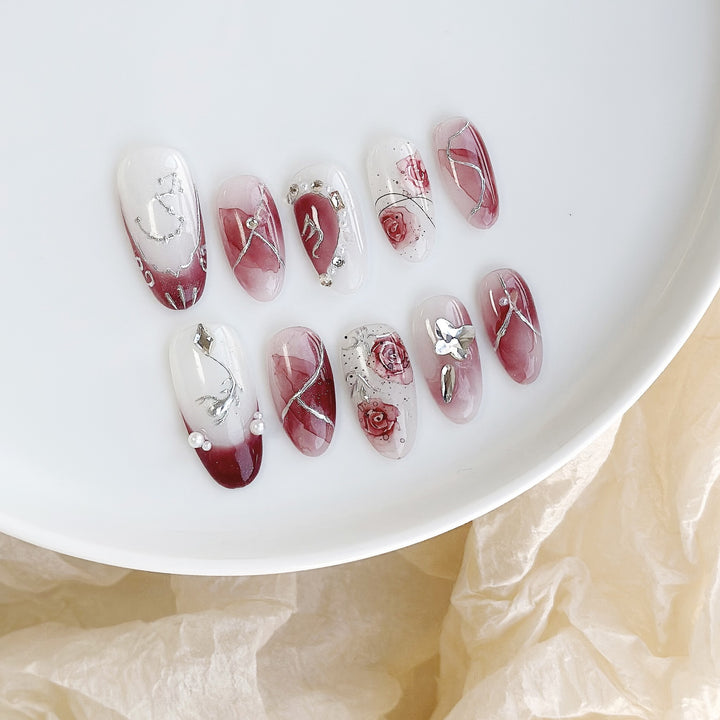 Artistic Press-On Nail Set with Floral Designs and Gem Accents