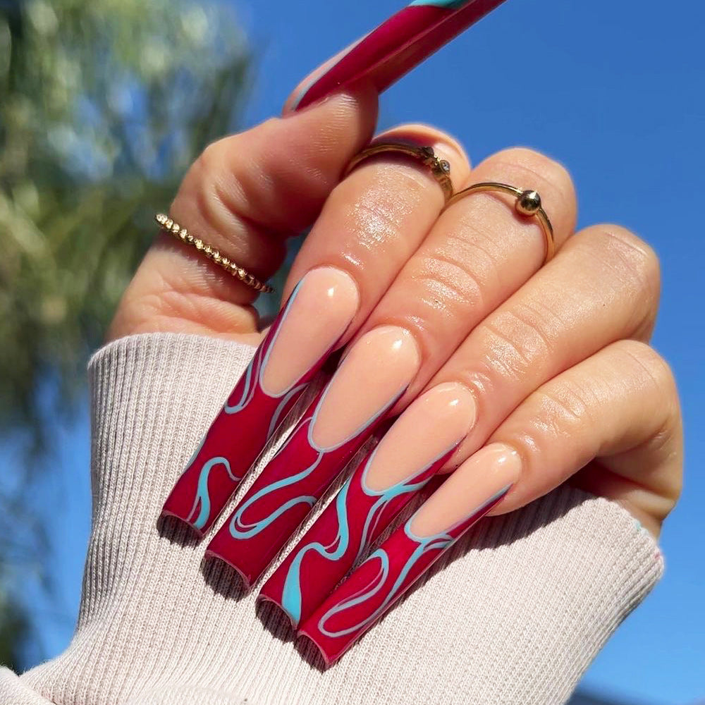 Artistic acrylic nails with floral and graphic accents Kalsten