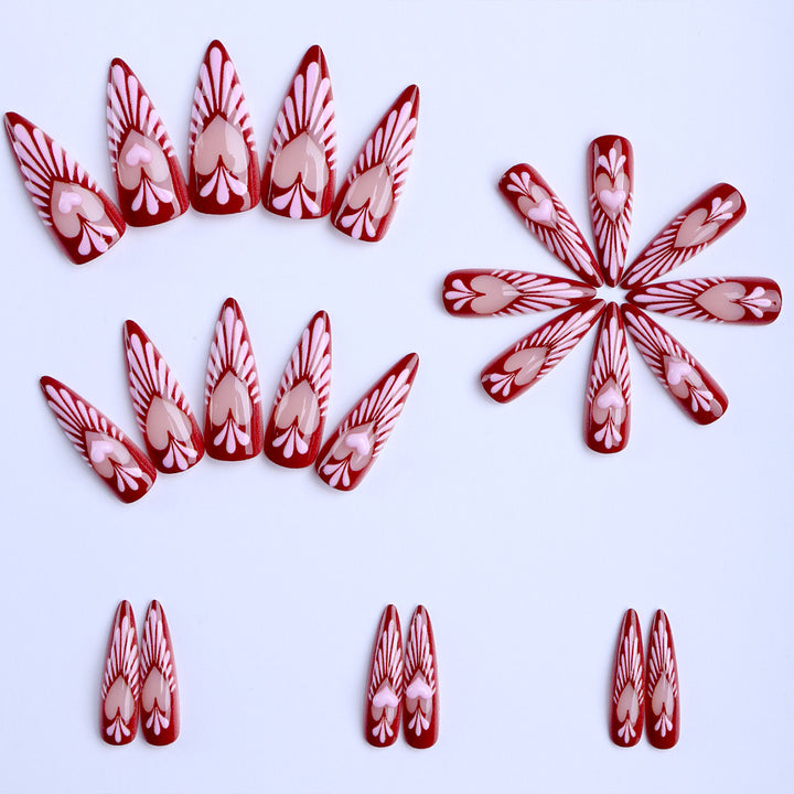 Artificial nails with playful heart design and elegant accents Kalsten