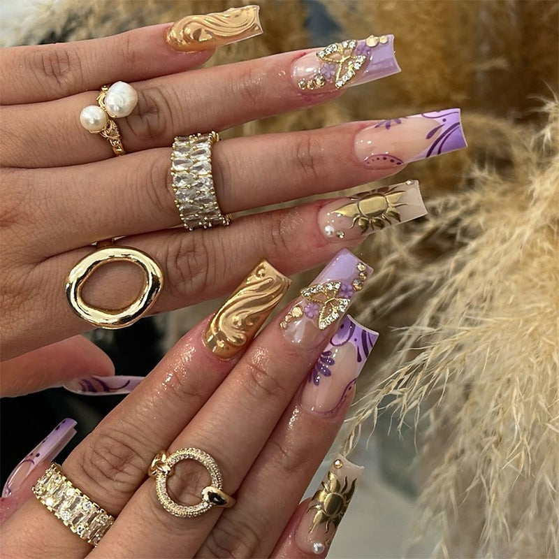 Artificial nail set with elegant floral design and glitter accents Kalsten
