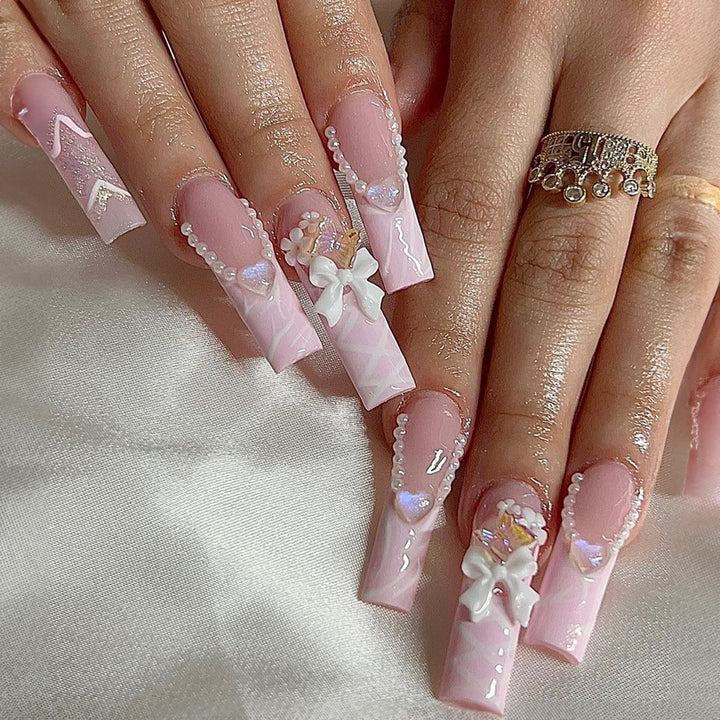 Creative acrylic nail set with delicate pearl and gloss accents Kalsten