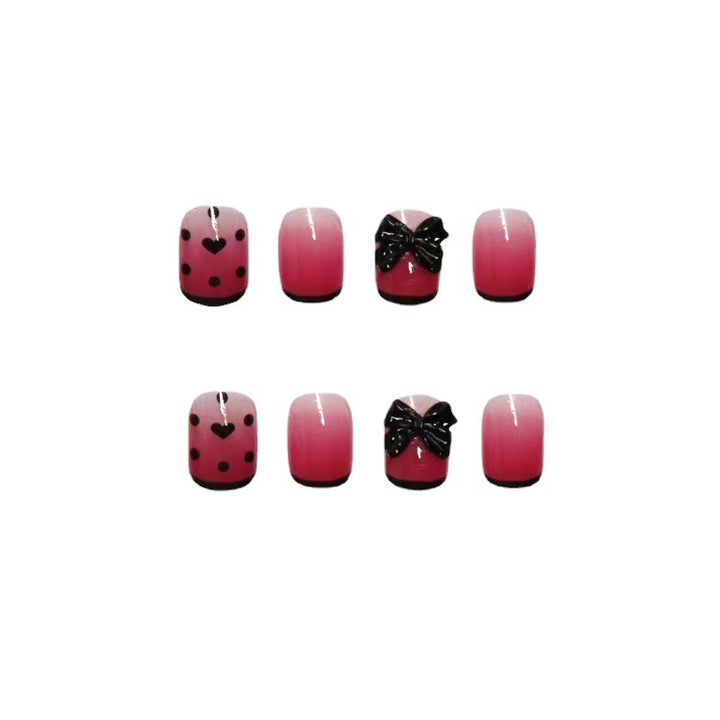 Themed Press-On Nail Set with Decorative Heart and Bow Designs