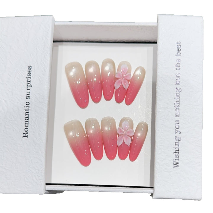 Artificial nails with romantic ombre design and floral accents Kalsten