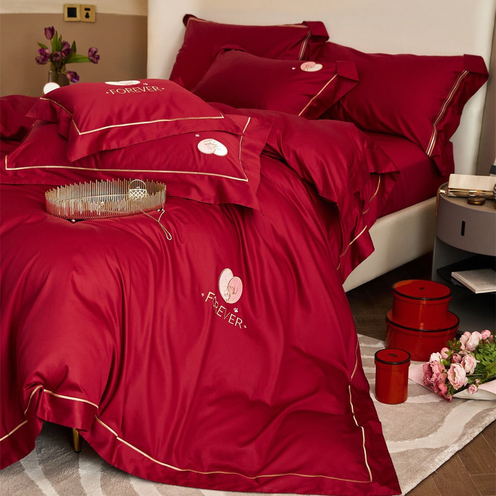 Premium cotton satin bedding set with gold piping and heart embroidery