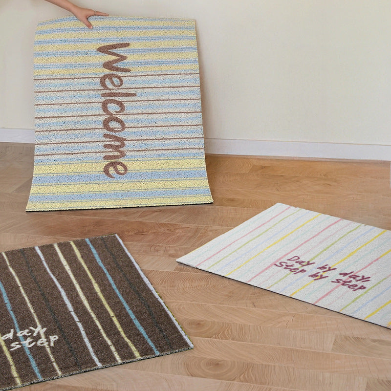 Durable entrance doormat with striped texture and "Welcome" lettering Kalsten