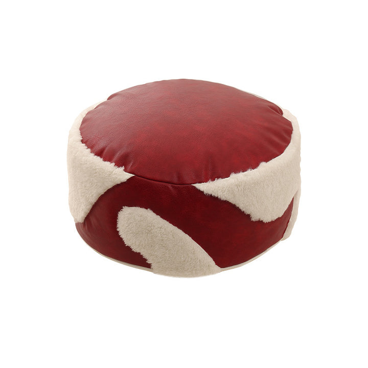 Round seating pouf with faux leather cover and Sherpa applications