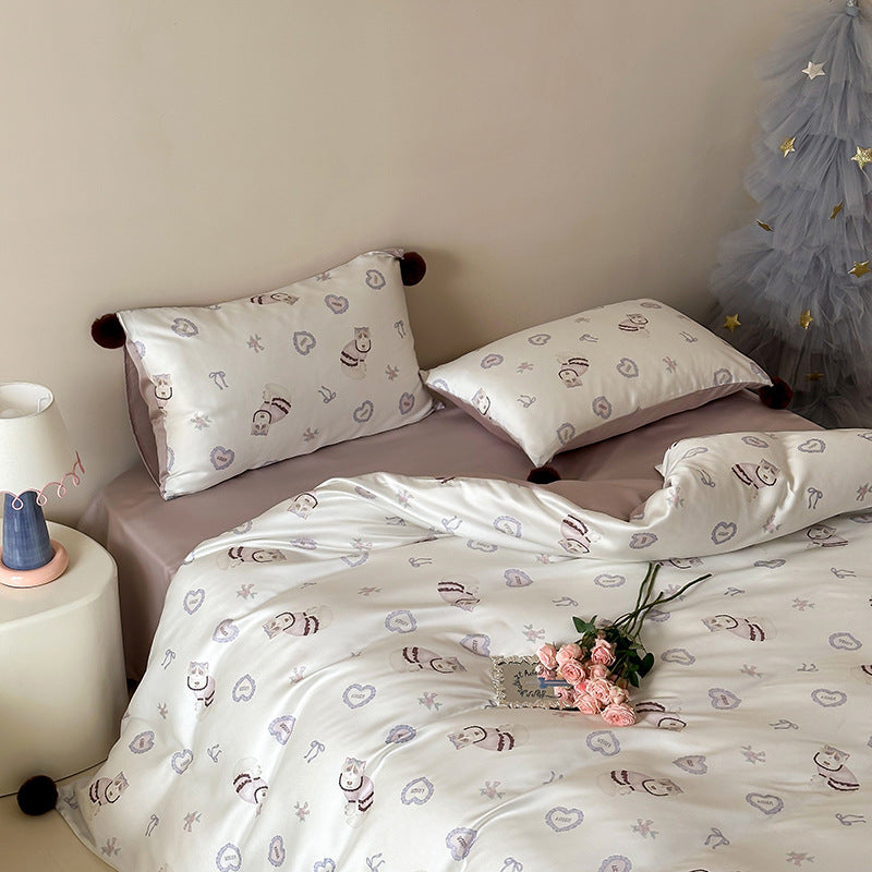 Children's bedding set with cute bunny print, pom-pom corners, and soft cotton satin