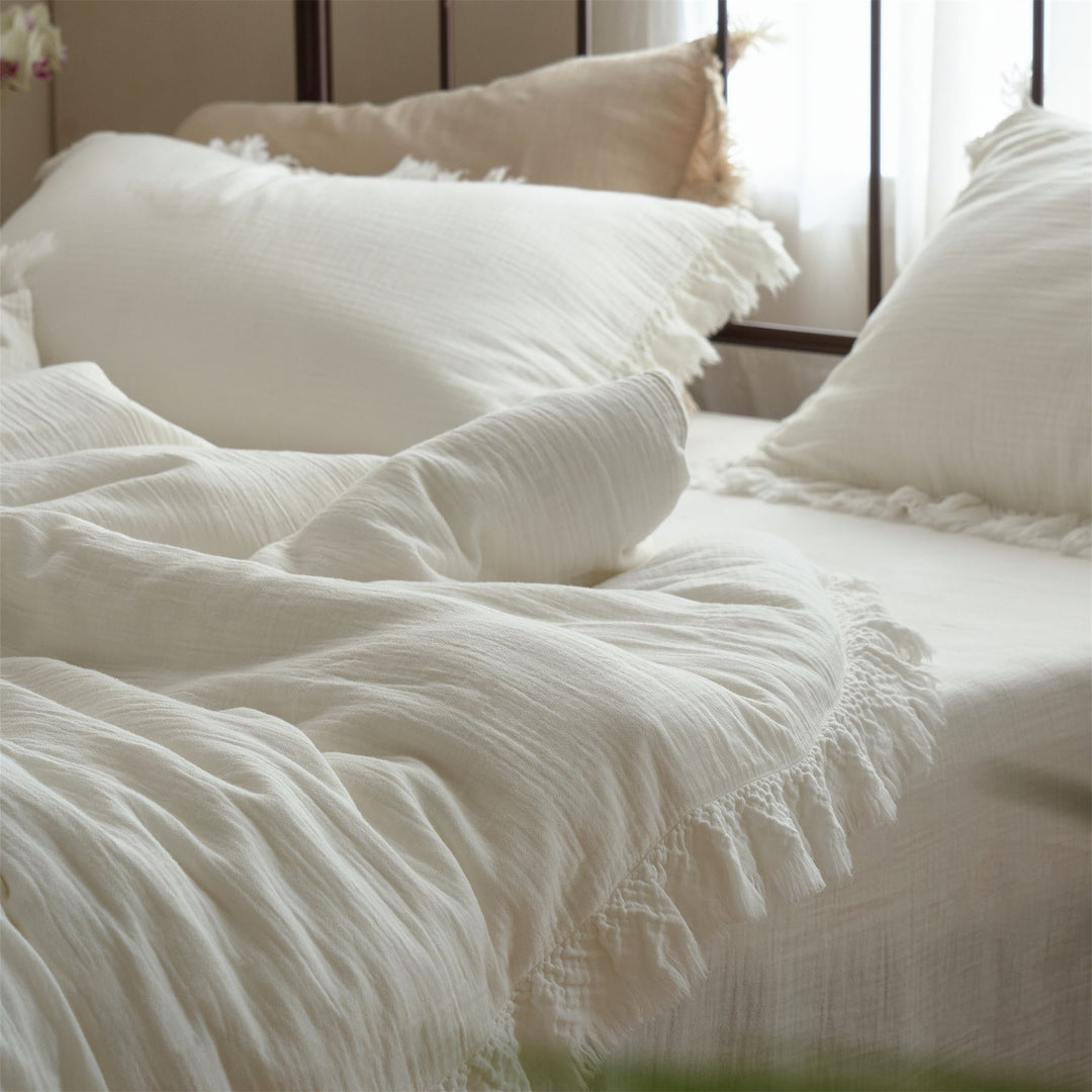 Washed linen bedding set with fringe trim and natural texture