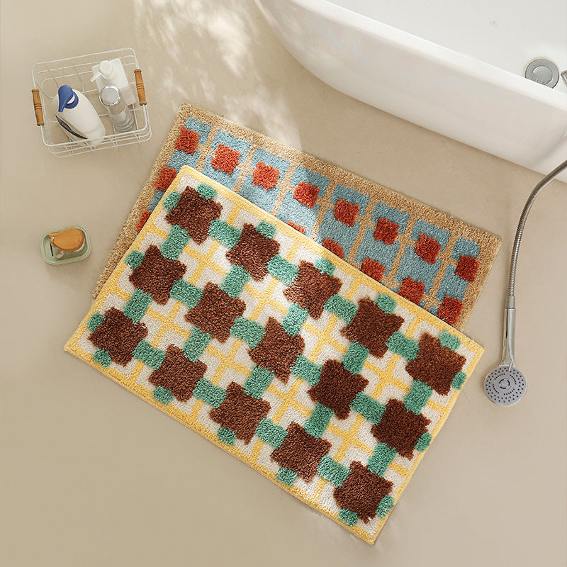 Hand-tufted bathroom bath mat with non-slip backing and textured square relief Kalsten