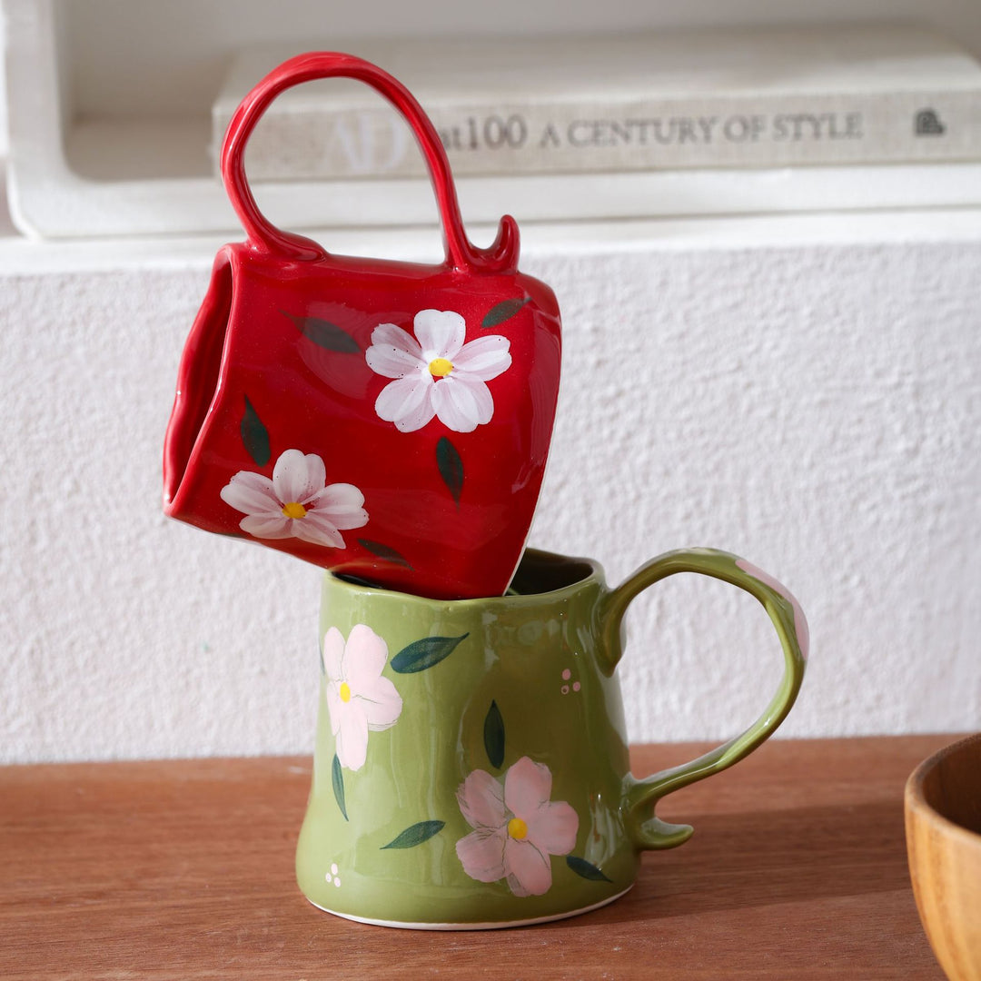 Hand-shaped ceramic mug with cloud relief and organic edge