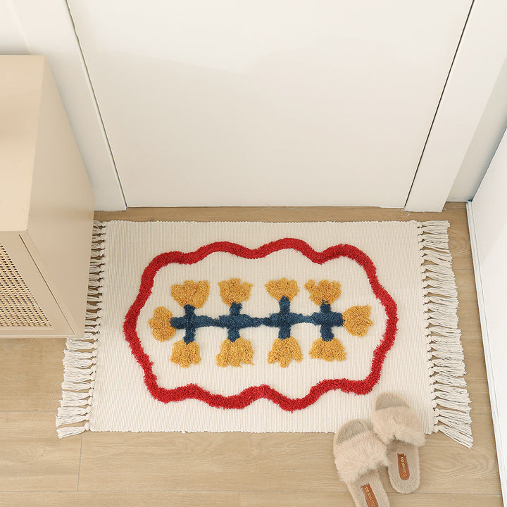 Decorative cotton bath mat with fringes and textured floral border