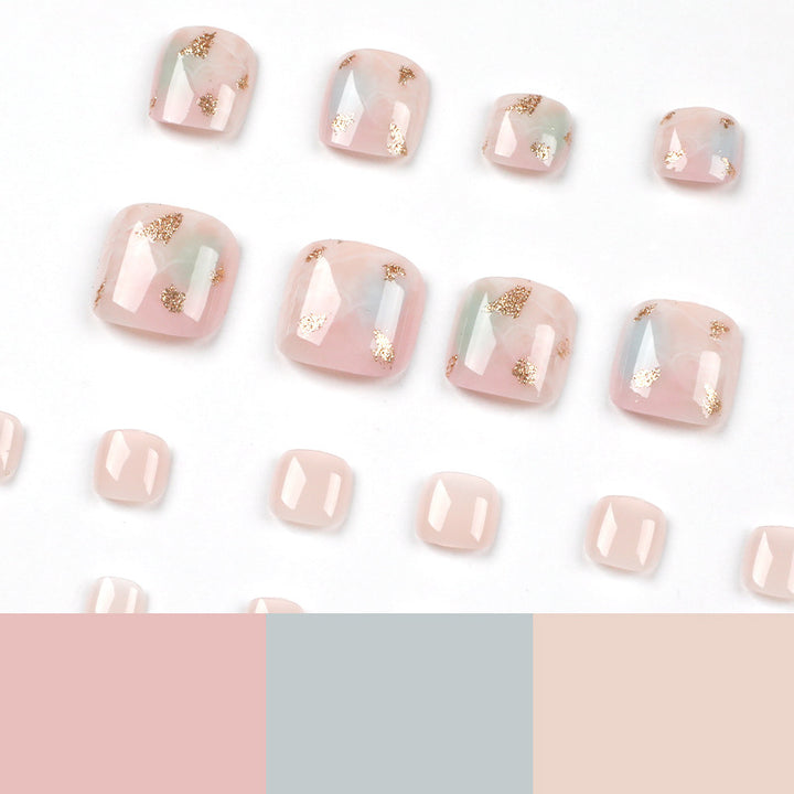Artful toenail art with elegant marble and gold accents Kalsten