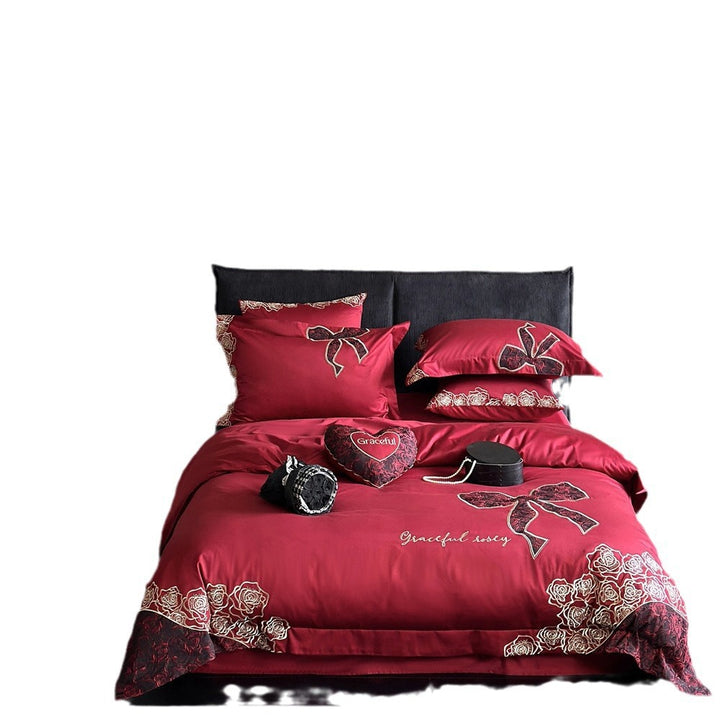 Luxurious satin bedding set with embroidered rose and bow motif