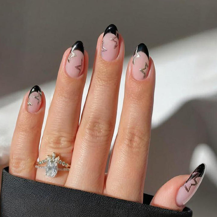 Acrylic nail set with elegant French tip design and glamorous accents Kalsten