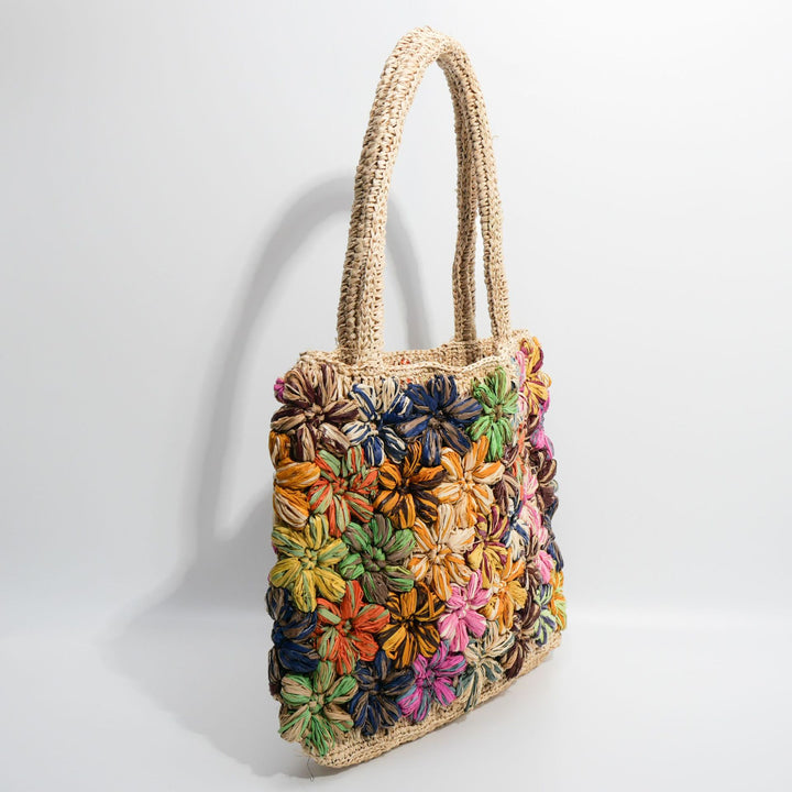 Handcrafted straw bag with floral appliqués Kalsten
