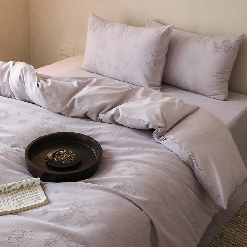 Exclusive cotton satin bedding set with tonal floral jacquard and fine decorative embroidery