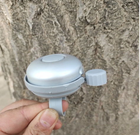 compact bicycle bell with quick-release handlebar mount Kalsten