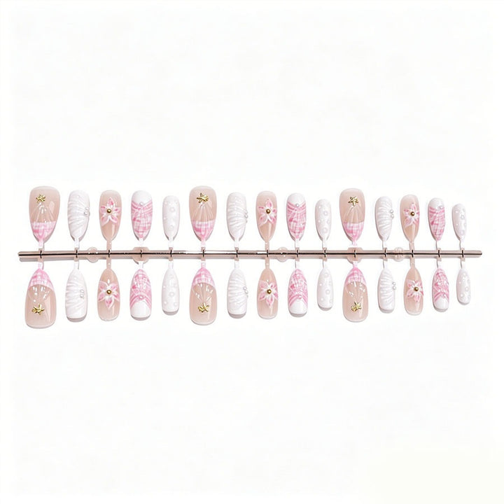 Art nail set with elegant floral decorations and glitter accents Kalsten