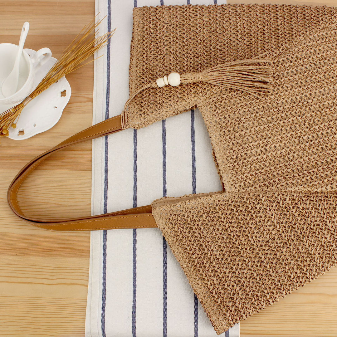 Beach bag made of natural weave with elegant leather accents Kalsten