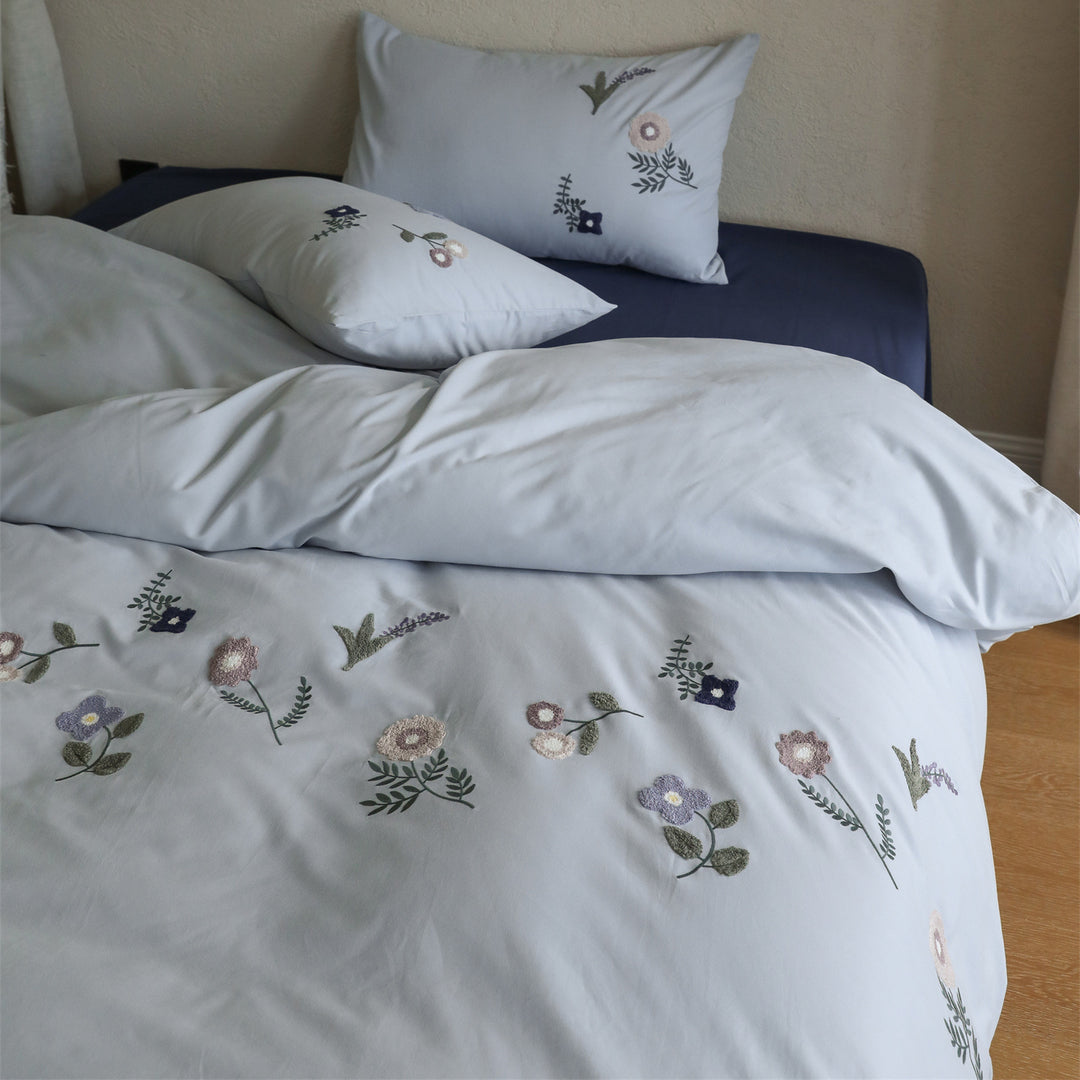 Embroidered cotton bedding set with delicate wildflower embroidery and percale texture