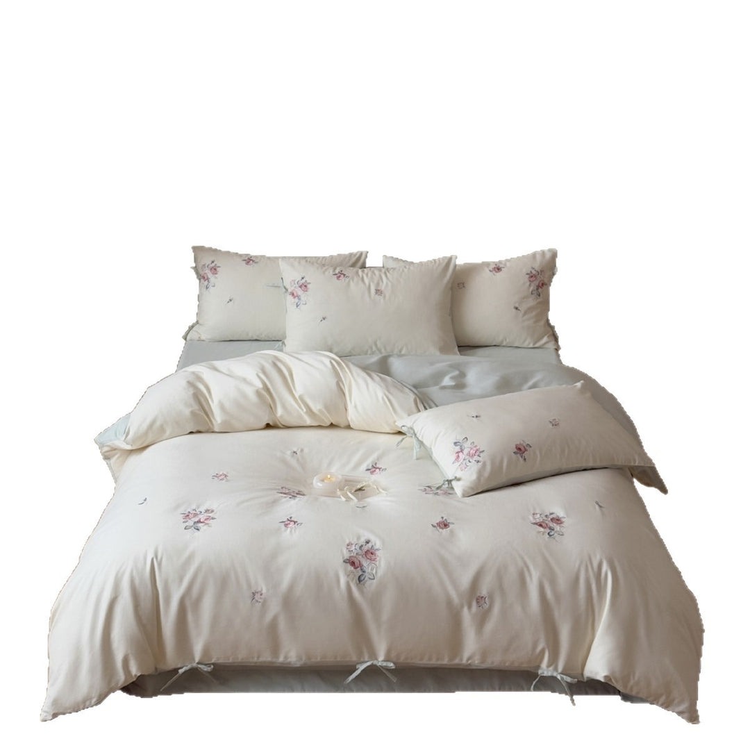 Luxurious cotton bedding set with delicate floral embroidery and reversible pillowcases