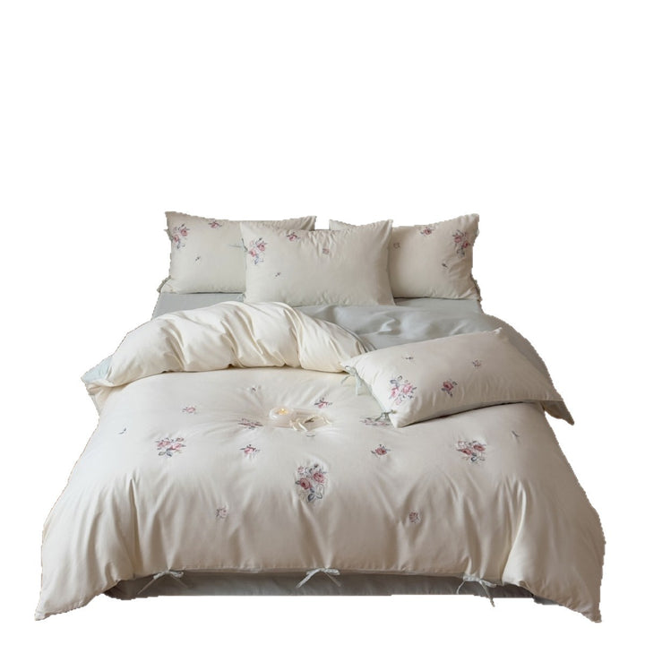 Luxurious cotton bedding set with delicate floral embroidery and reversible pillowcases